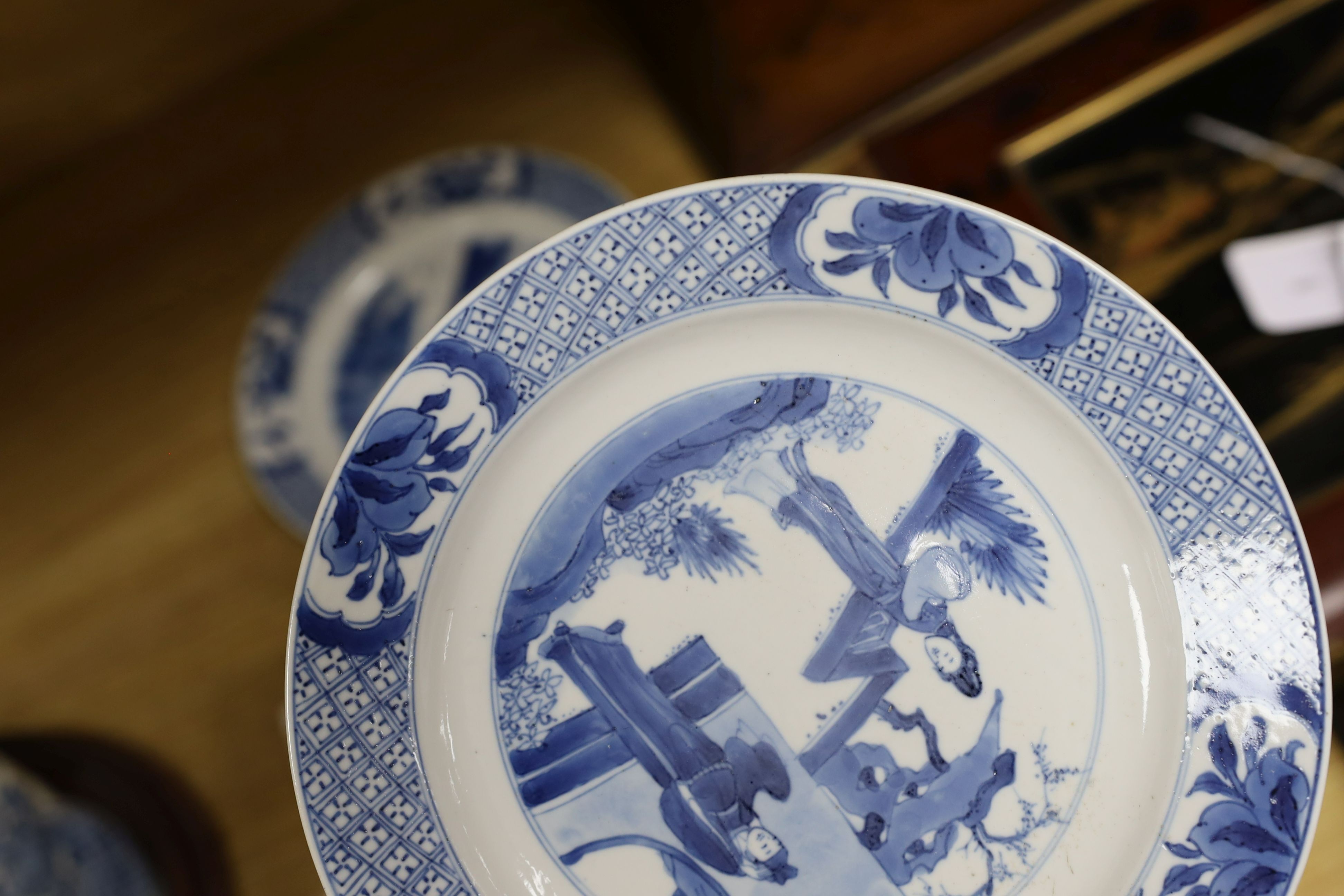 Two Chinese blue and white plates, Kangxi period, one with Kangxi mark the other a Chenghua mark, 21 cms diameter